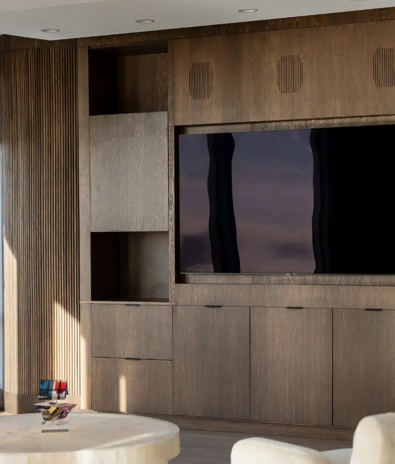 Custom media wall in rift oak with a stain by BradleyBuilt