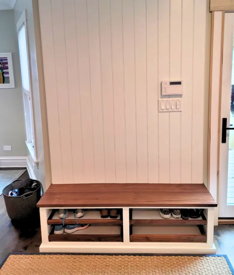 Bespoke mudroom bench with walnut pull out shelf