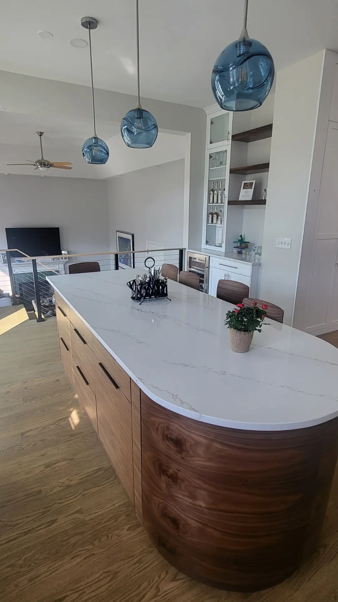Walnut island cabinet with a radius front